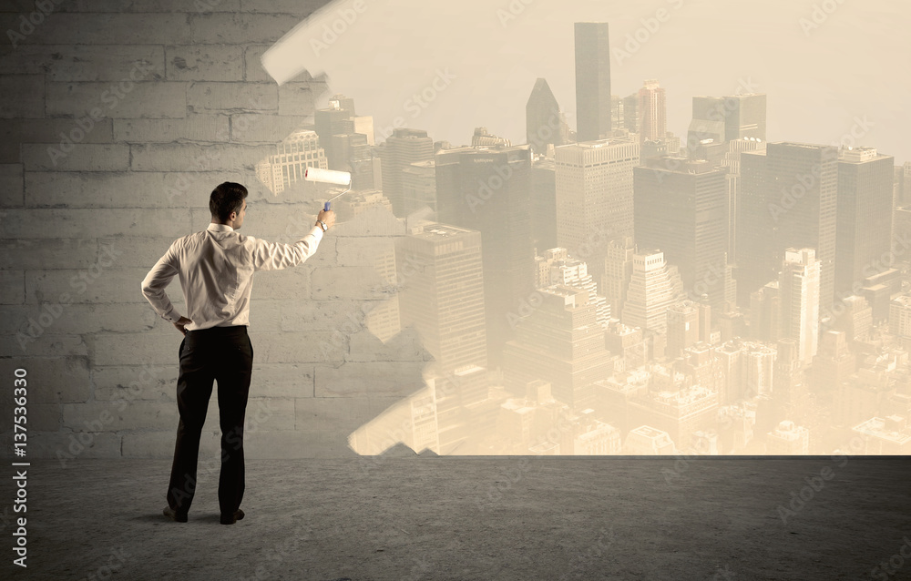 Salesman painting city scape on wall Salesman painting city scape on wall