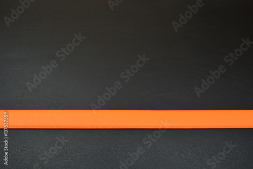 Orange belt on black background