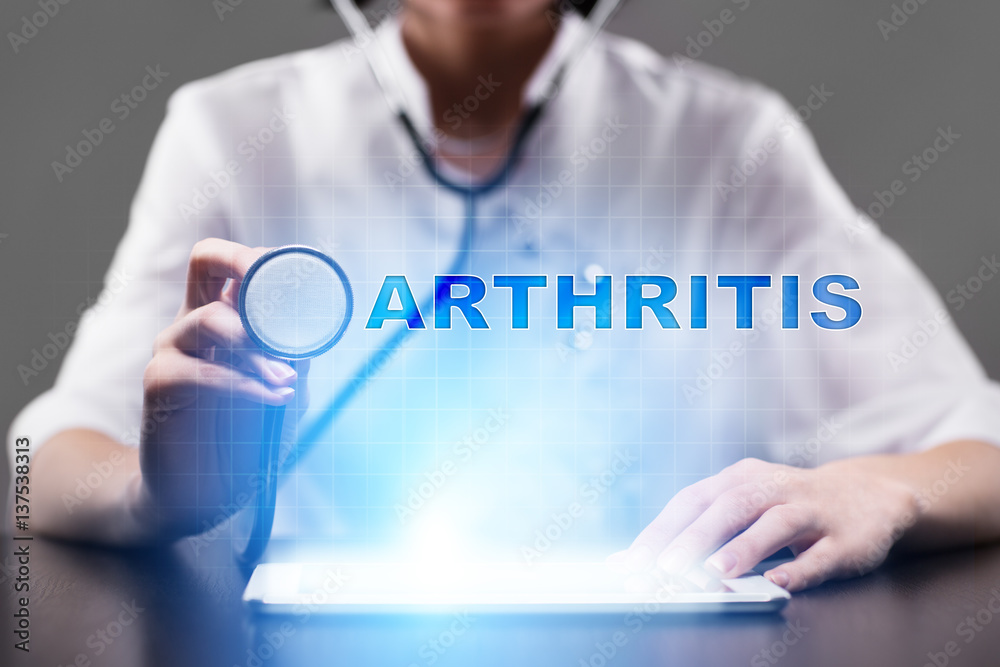 Medical doctor working with modern computer and pressing button arthritis. Medical concept.