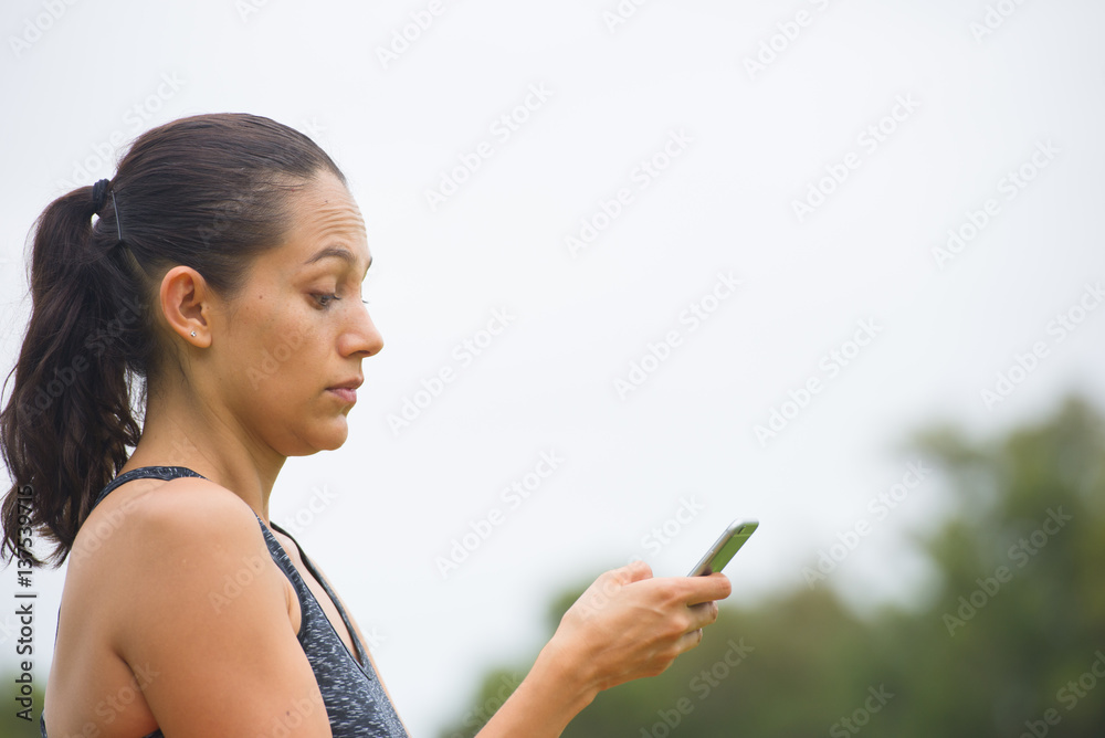 Young surprised woman on smart phone outdoor Young surprised woman on smart phone outdoor