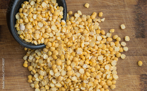 Dry Split Yellow Peas Scattered out of the Black Bowl