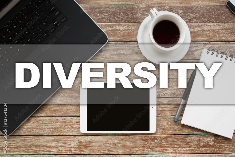Tablet on desktop with diversity text. Tablet on desktop with diversity text.