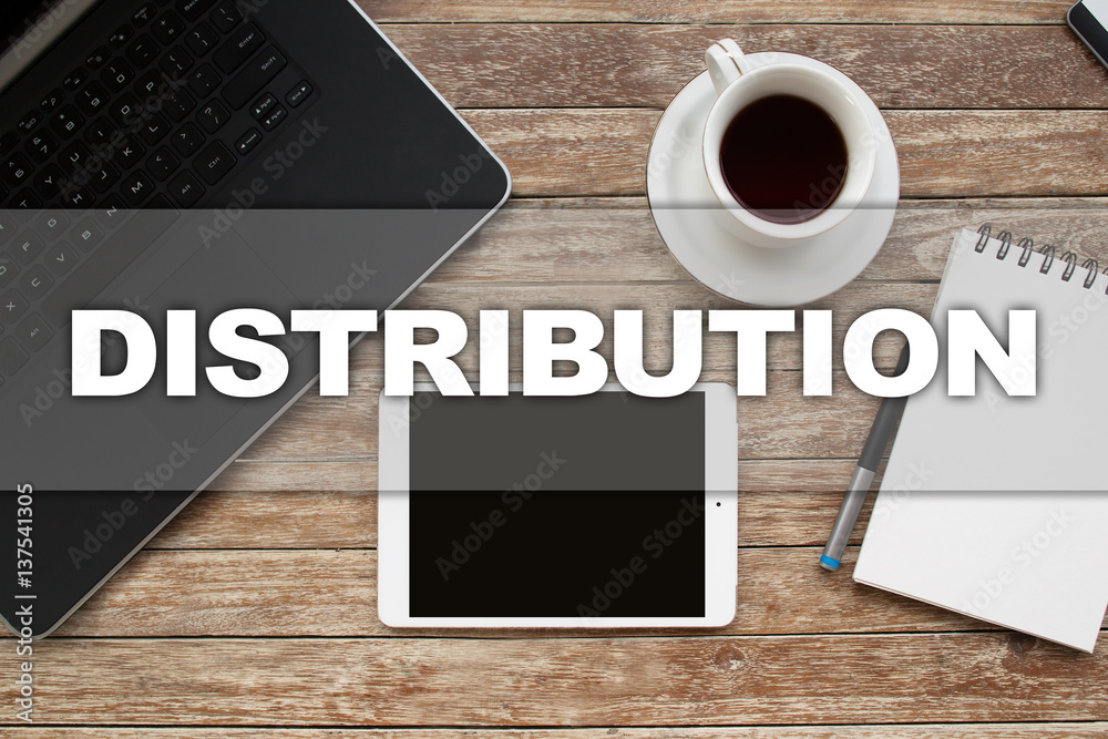 Tablet on desktop with distribution text. Tablet on desktop with distribution text.