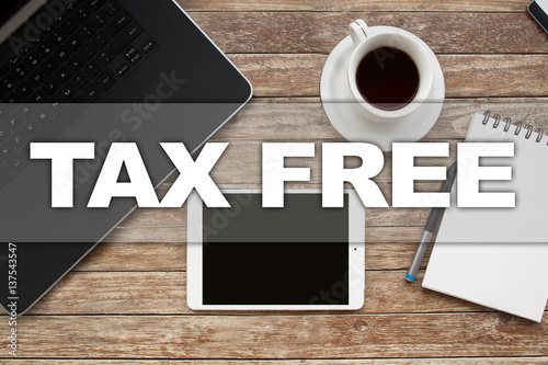 Tablet on desktop with tax free text.