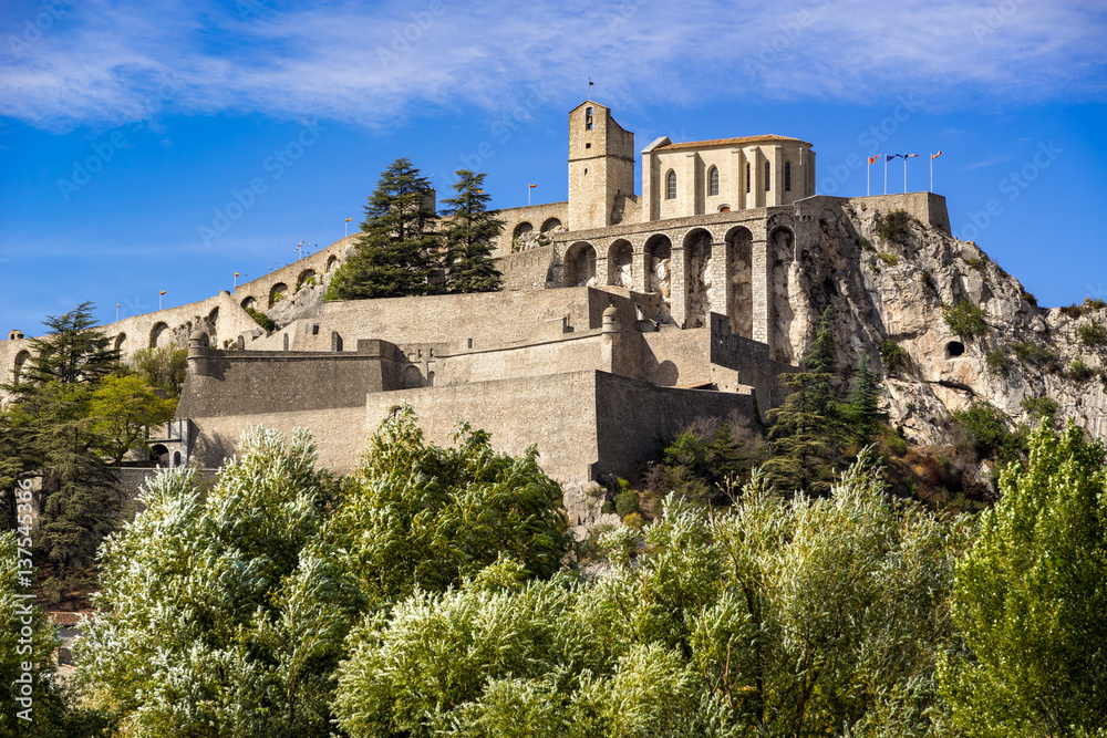 Citadel of Sisteron and its fortifications in summer. Alpes de Haute Provence, Southern Alps, France