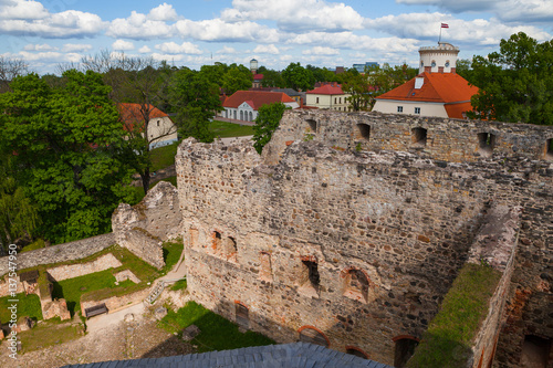 Aerial view of beautiful ruins of ancient Livonian castle in old town of Cesis, Latvia. Greenery and summer daytime.