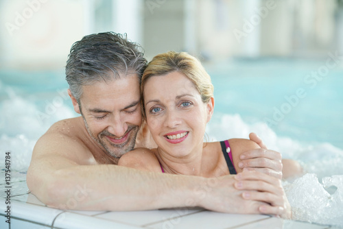 Couple relaxing in thalassotherapy hot tub © goodluz