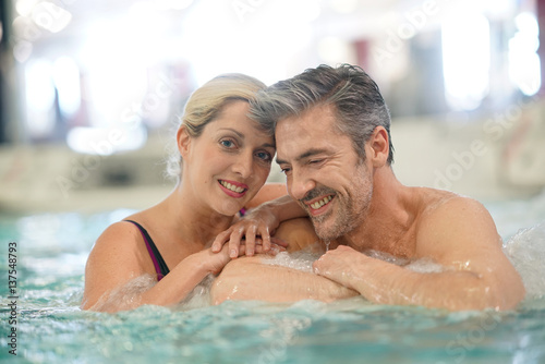 Couple relaxing in thalassotherapy hot tub © goodluz