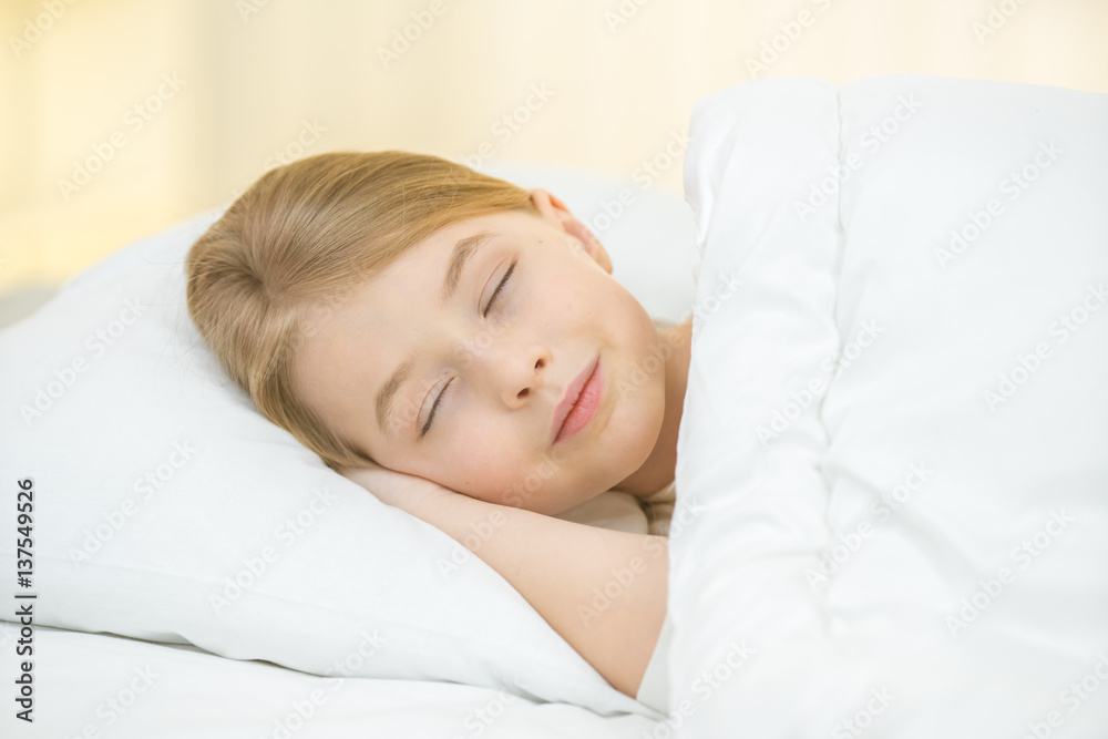 The cute girl sleeping on the bed The cute girl sleeping on the bed