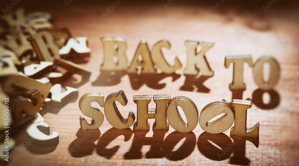 word Back to School on wooden background word Back to School on wooden background