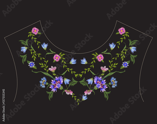 Embroidery ethnic neck line floral pattern with blue cornflowers. Vector symmetric traditional folk flowers ornament on black background for design.