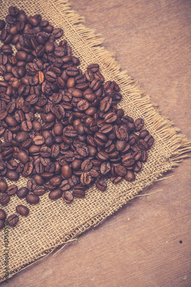 Coffee beans on wooden table