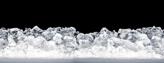 Pieces of crushed ice cubes on black background. Including clipping path.