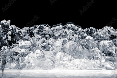 Pieces of crushed ice cubes on black background. Including clipping path.