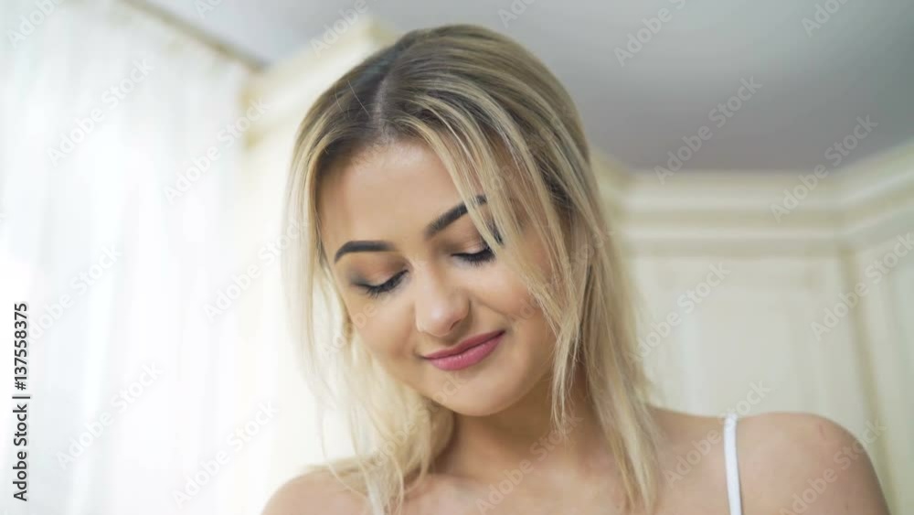 Happy look of the blonde cooking on the kitchen in 4K Happy look of the blonde cooking on the kitchen in 4K