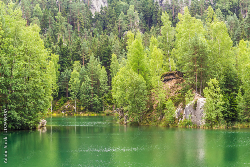 Green lake in the rock city in the Czech republic.