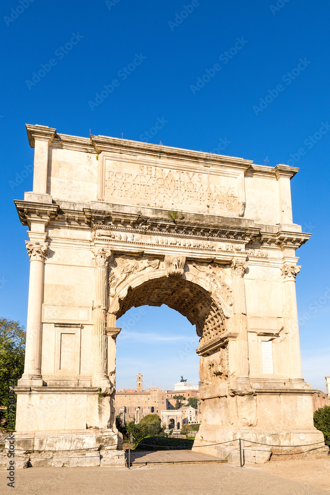 Rome, Italy. Arch in arch: Arch of Septimius Severus (205 AD), which is visible in the opening Arch of Titus (82 AD)