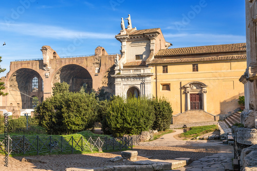 Rome, Italy. Roman Forum: Basilica of Maxentius (left) and the medieval church of Santa Francesca Romana