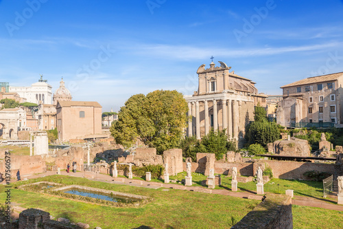 Rome, Italy. In the foreground - the ruins of the House of the Vestal. Further, from the left to right: the ruins of the Temple of Vesta, the Curia Julia, the Temple of Antoninus and Faustina (141 AD)