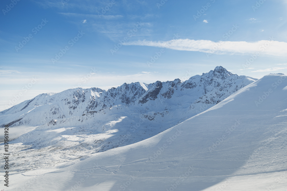 Snowy slopes in winter mountains. Skiing resorts. Snowy slopes in winter mountains. Skiing resorts.