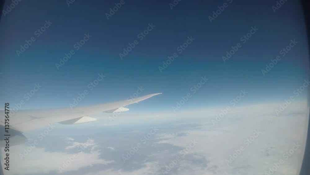 Traveling by air. Wonderful view of the sky and clouds from above, as seen through an airplane window-Dan Traveling by air. Wonderful view of the sky and clouds from above, as seen through an airplane window-Dan