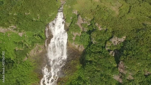 Beautiful flight copter over the waterfall