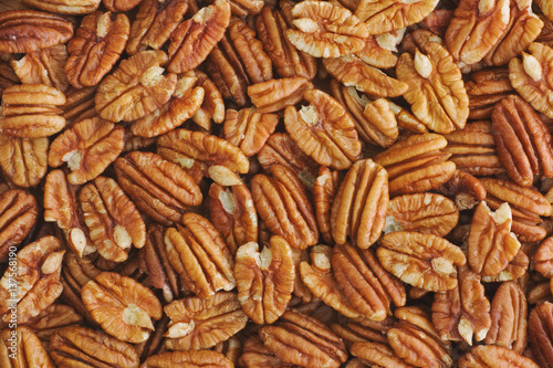 Lots of raw organic pecan nuts photo