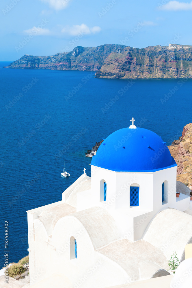 Church with blue domes in Santorini island, Greece. Summer landscape, sea view