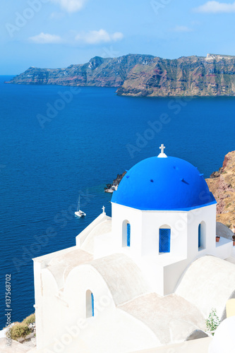 Church with blue domes in Santorini island, Greece. Summer landscape, sea view