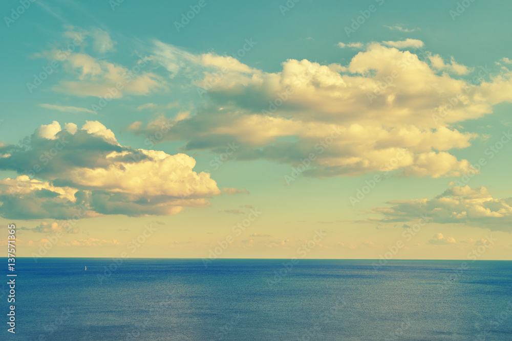 Sea idyll. Panorama of sky with clouds and sea. Beautiful sunshine. Sea surface