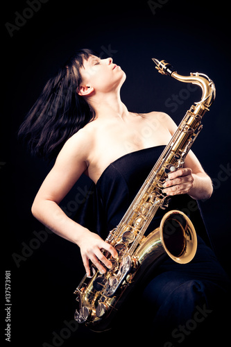 Young Woman Playing The Sax