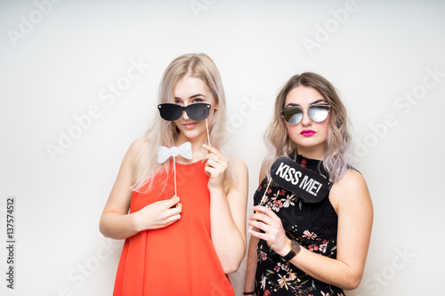 happy ladies girls female with fancy dress photo booth props smile party white isolated background