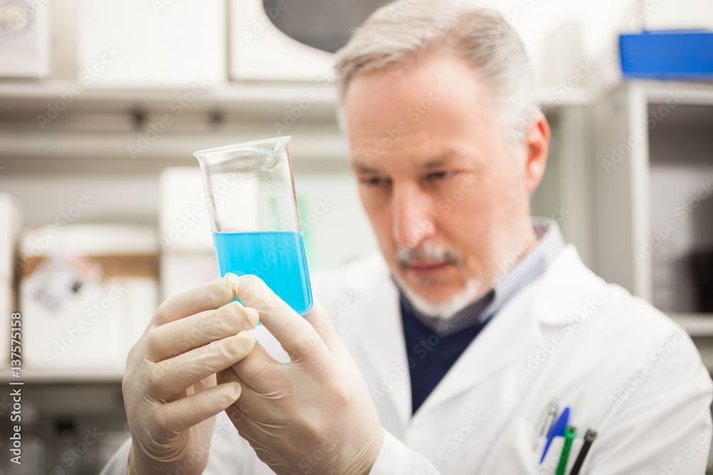 Scientist holding a test tube Scientist holding a test tube