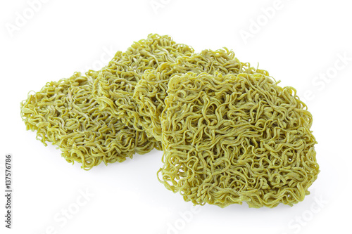 Dried organic green noodles on white background