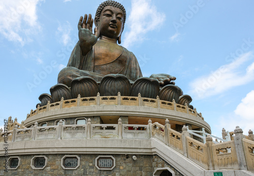 Giant Bronze Tian Tan Buddha statue on Lantau Island hillside