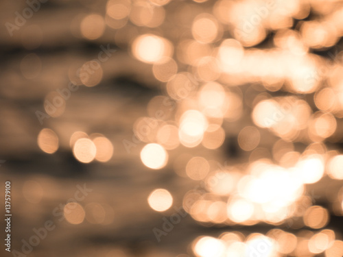 Water bokeh in the sea under sunset photo