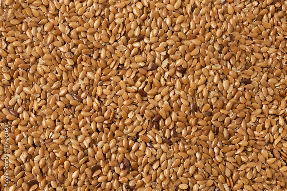 background of wholemeal raw flax seeds cereal. background of wholemeal raw flax seeds cereal.