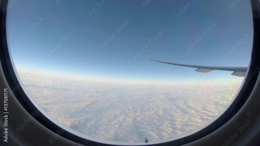Timelapse 4K Hd Ultra Traveling by air. Wonderful view of the sky and clouds from above, as seen through an airplane window-Dan Timelapse 4K Hd Ultra Traveling by air. Wonderful view of the sky and clouds from above, as seen through an airplane window-Dan