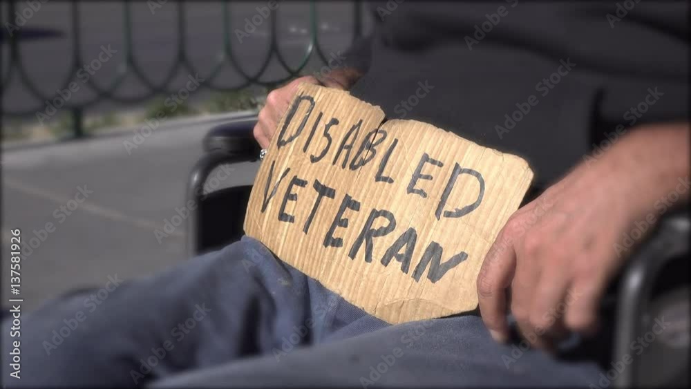 Disabled Veteran in wheelchair asking for help.
