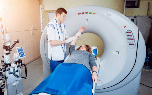 Medical equipment. Doctor and patient in the room of computed tomography