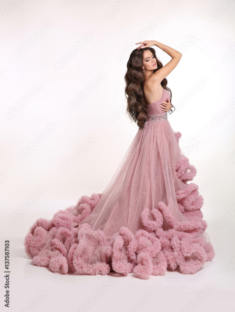 Beautiful Lady in luxury lush pink dress. Fashion brunette woman in  gorgeous long gown posing isolated on white studio background. Stock Photo  | Adobe Stock