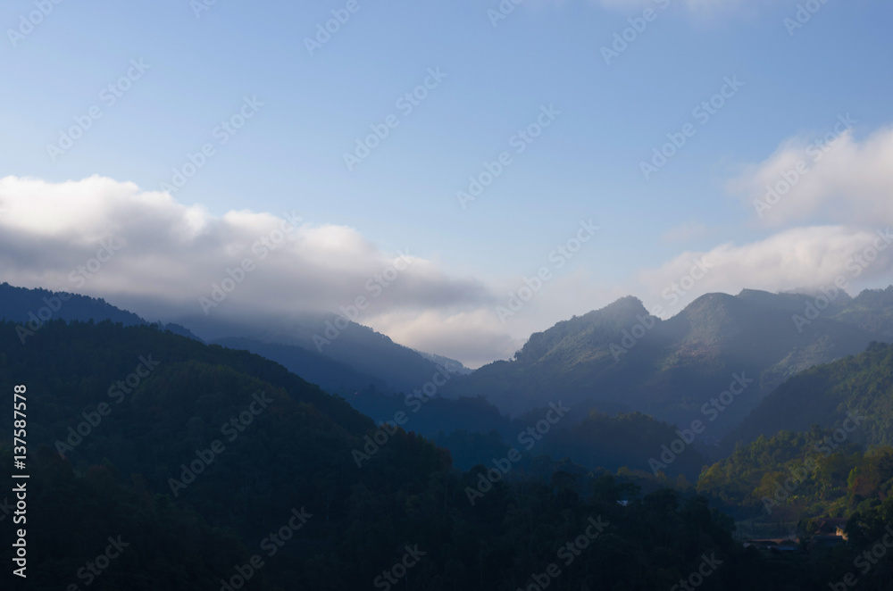 misty mountains with sky and cloud at morning.