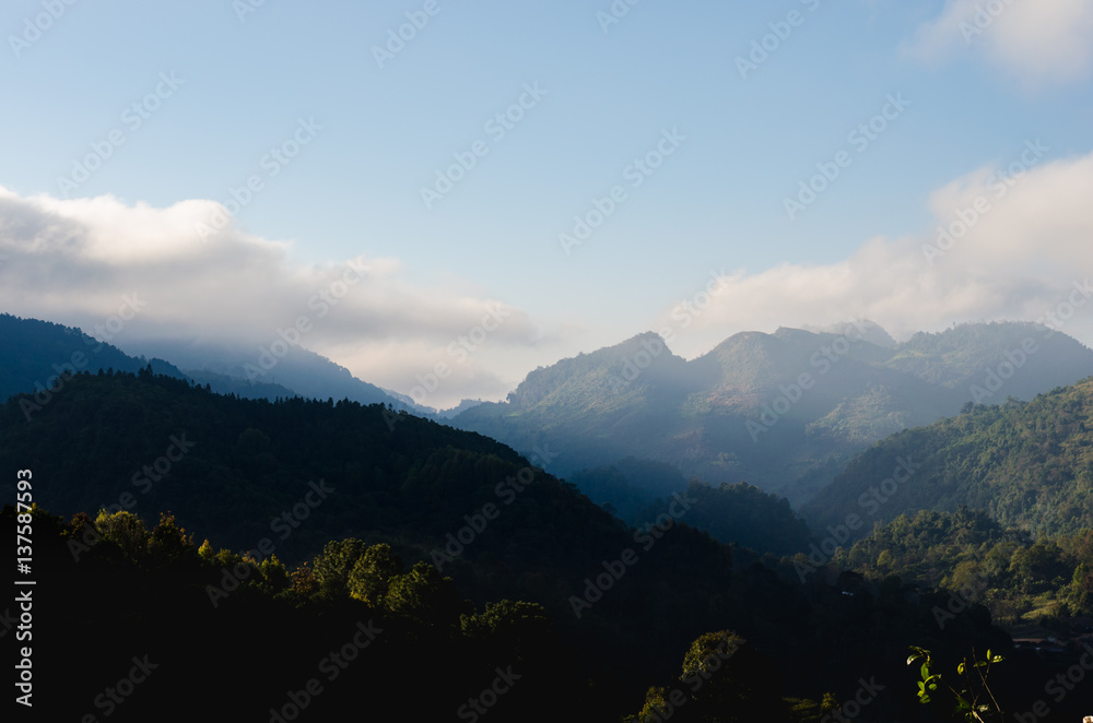 misty mountains with sky and cloud at morning.