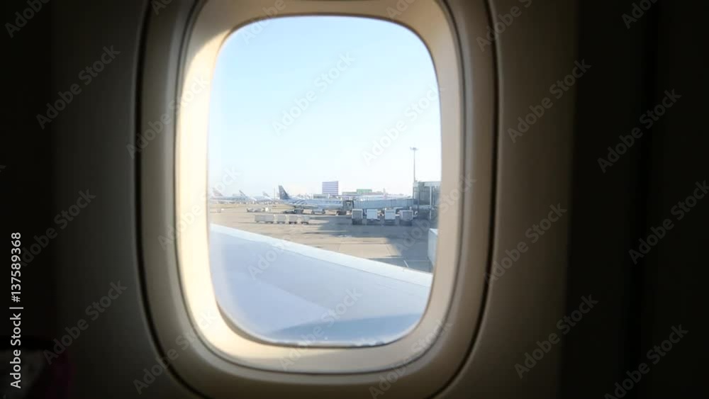 passengers sitting inside airplane while waiting for takeoff-Dan