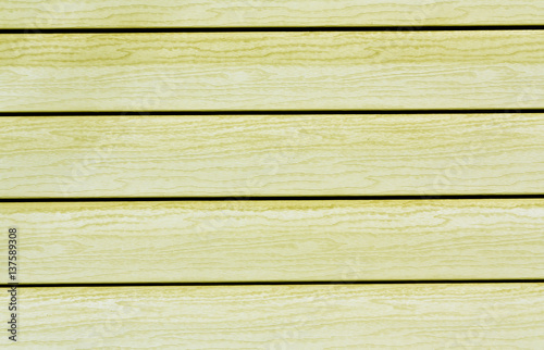 Yellow color plastic house wall.