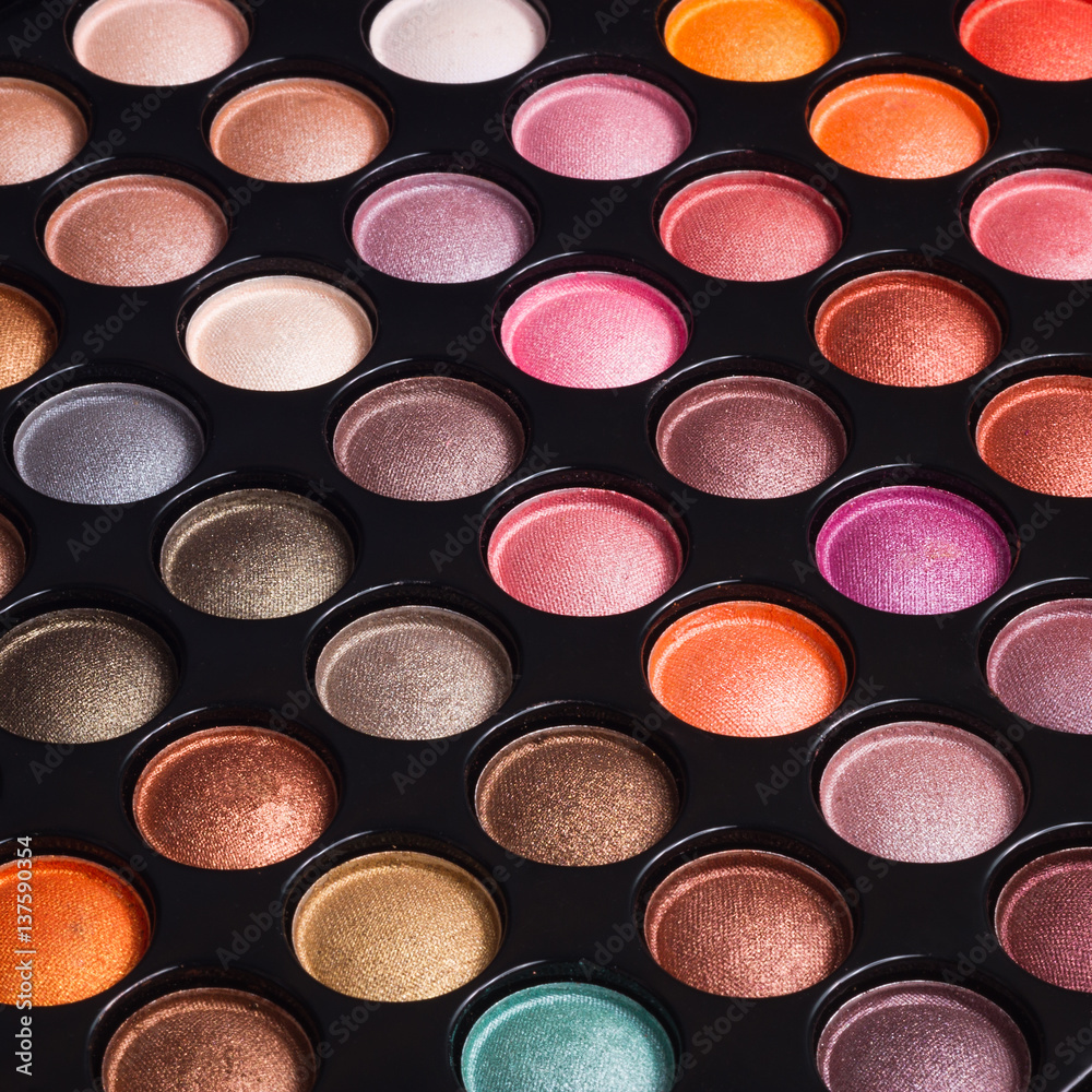 Closeup of make-up eye shadows. Makeup palette. Make-up background Closeup of make-up eye shadows. Makeup palette. Make-up background