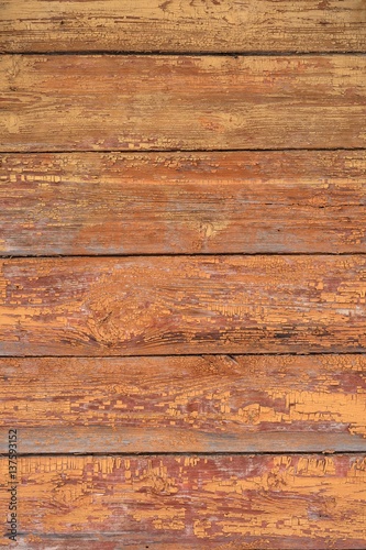 Old shabby wooden wall painted faded brown