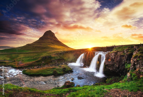The picturesque sunset over landscapes and waterfalls. Kirkjufel