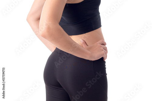 part of the body a young girl in black sport trousers close-up