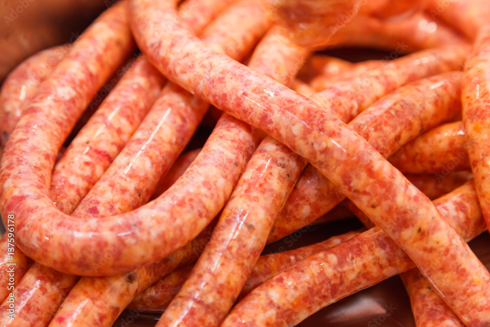 Close view of homemade raw thin sausages Close view of homemade raw thin sausages